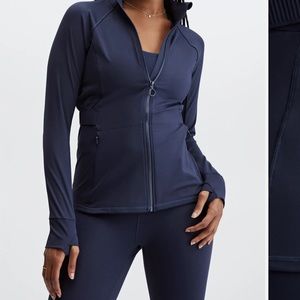 Blue zip up athletic jacket